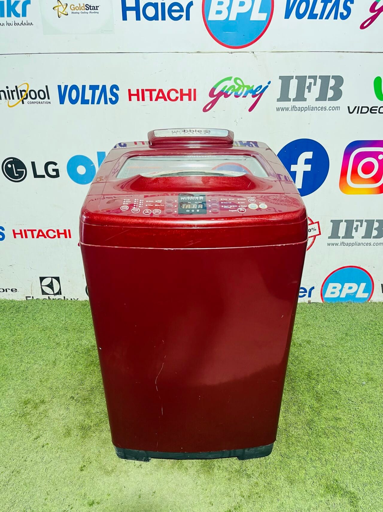 Samsung bight red in colour with wobble technology 6.5 kg gently used fully automatic top load washing machine in banglore