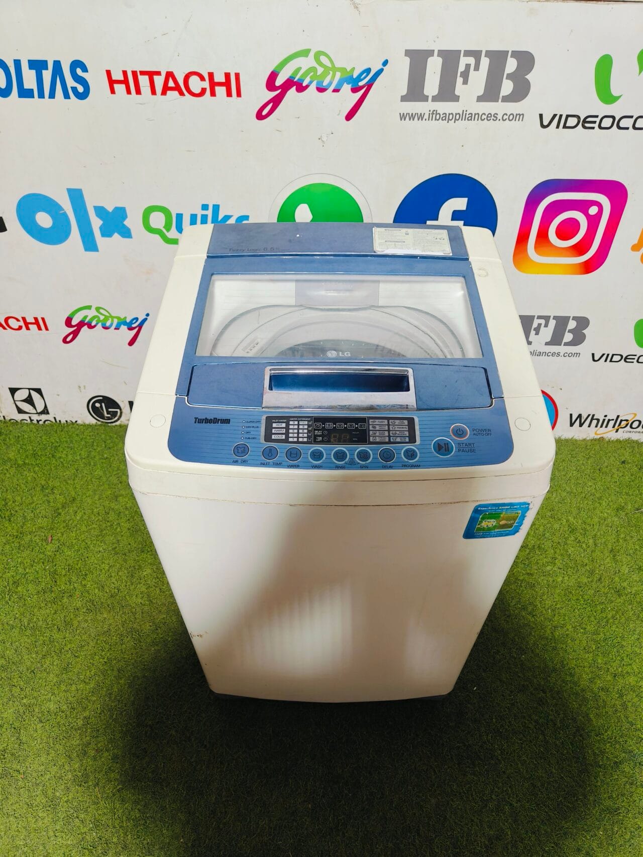 LG fuzzy logic turbo drum 6.5 kg gently used white and blue in colour fully automatic top load washing machine - Image 2