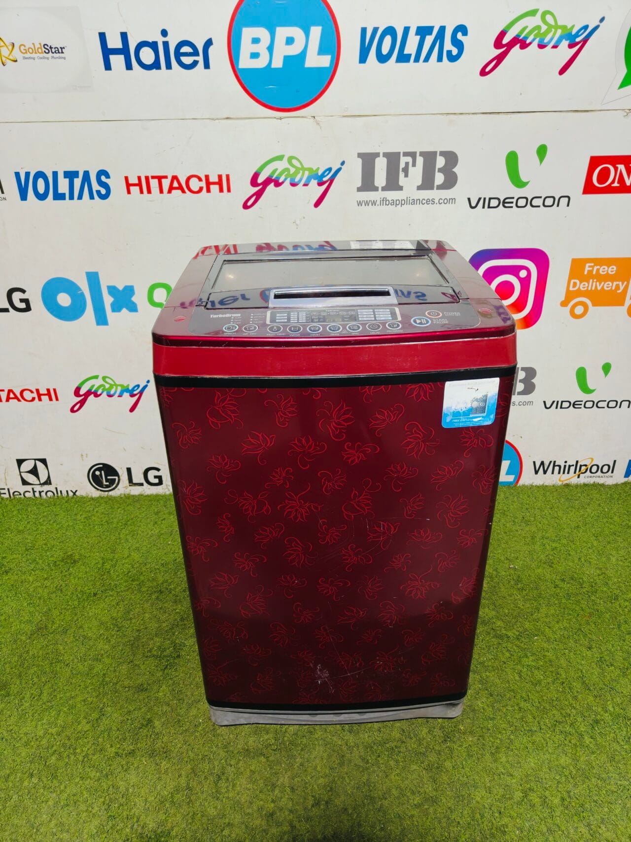 LG fuzzy logic turbo drum 6.5 kg fully automatic red flower printed gently used top load washing machine
