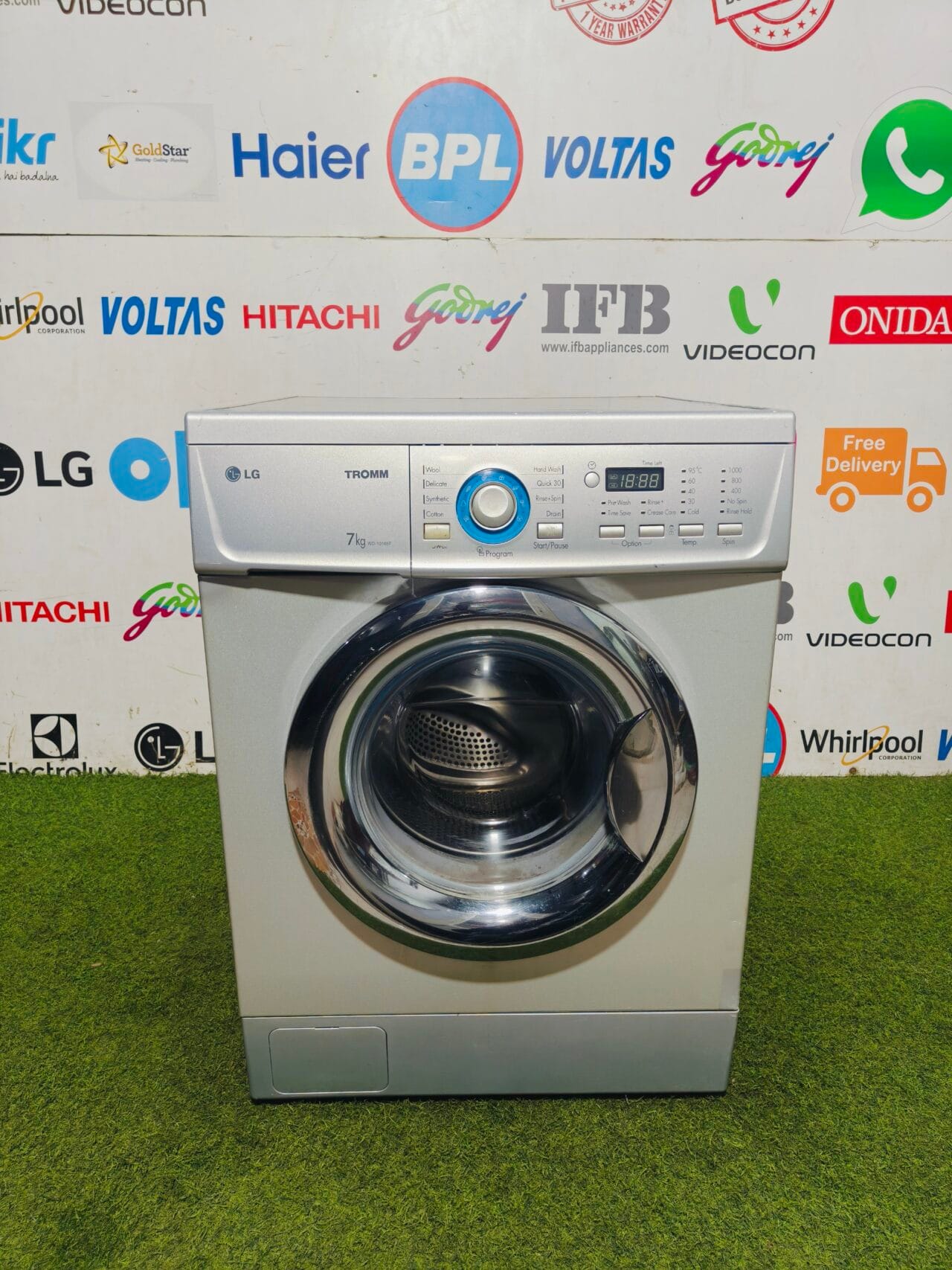 LG tromm silver in colour 7 kg fully automatic front load gently used washing machine