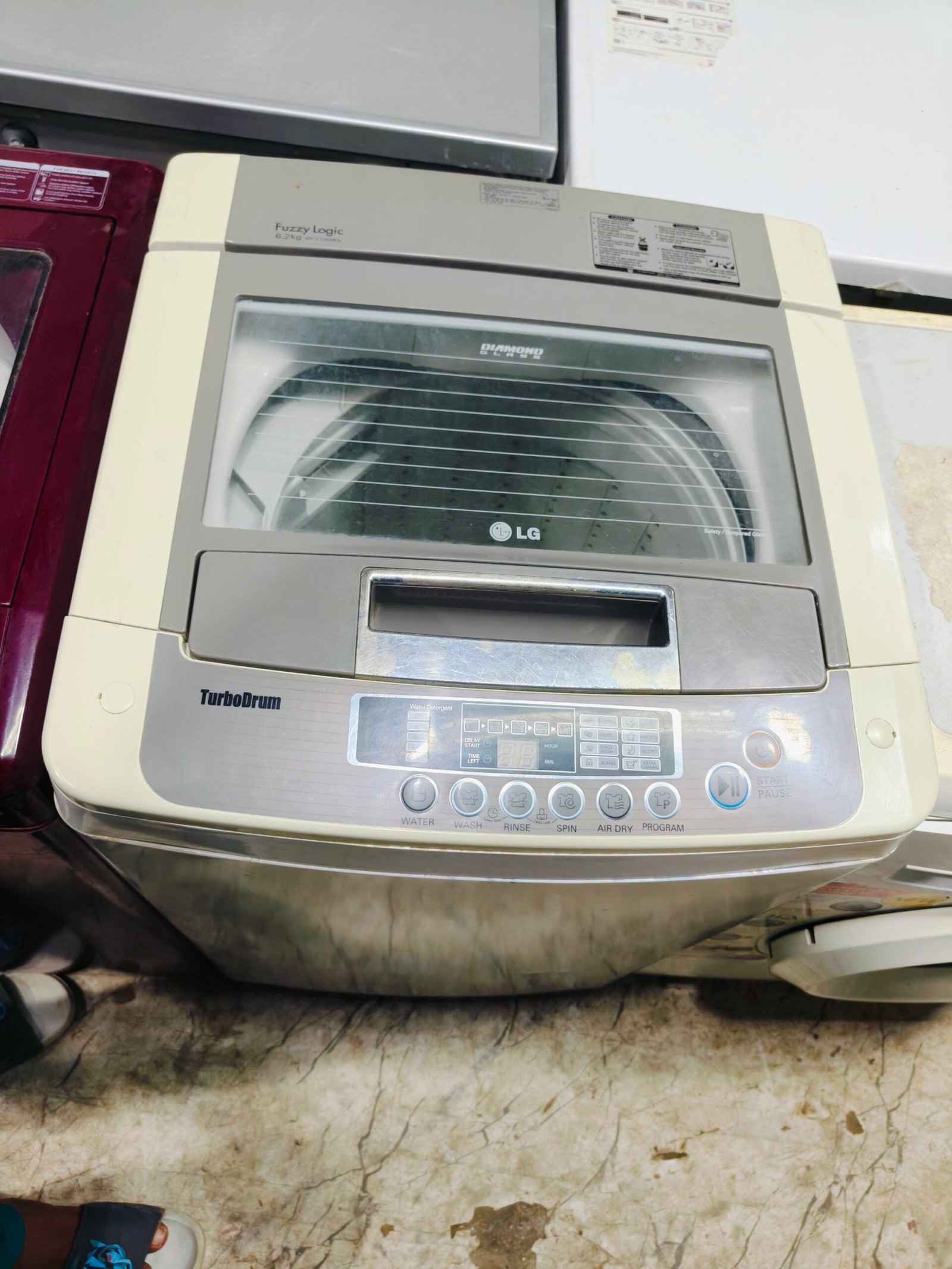 LG fuzzy logic turbo drum 6.2 kg fully automatic gently used top load washing machine - Image 2