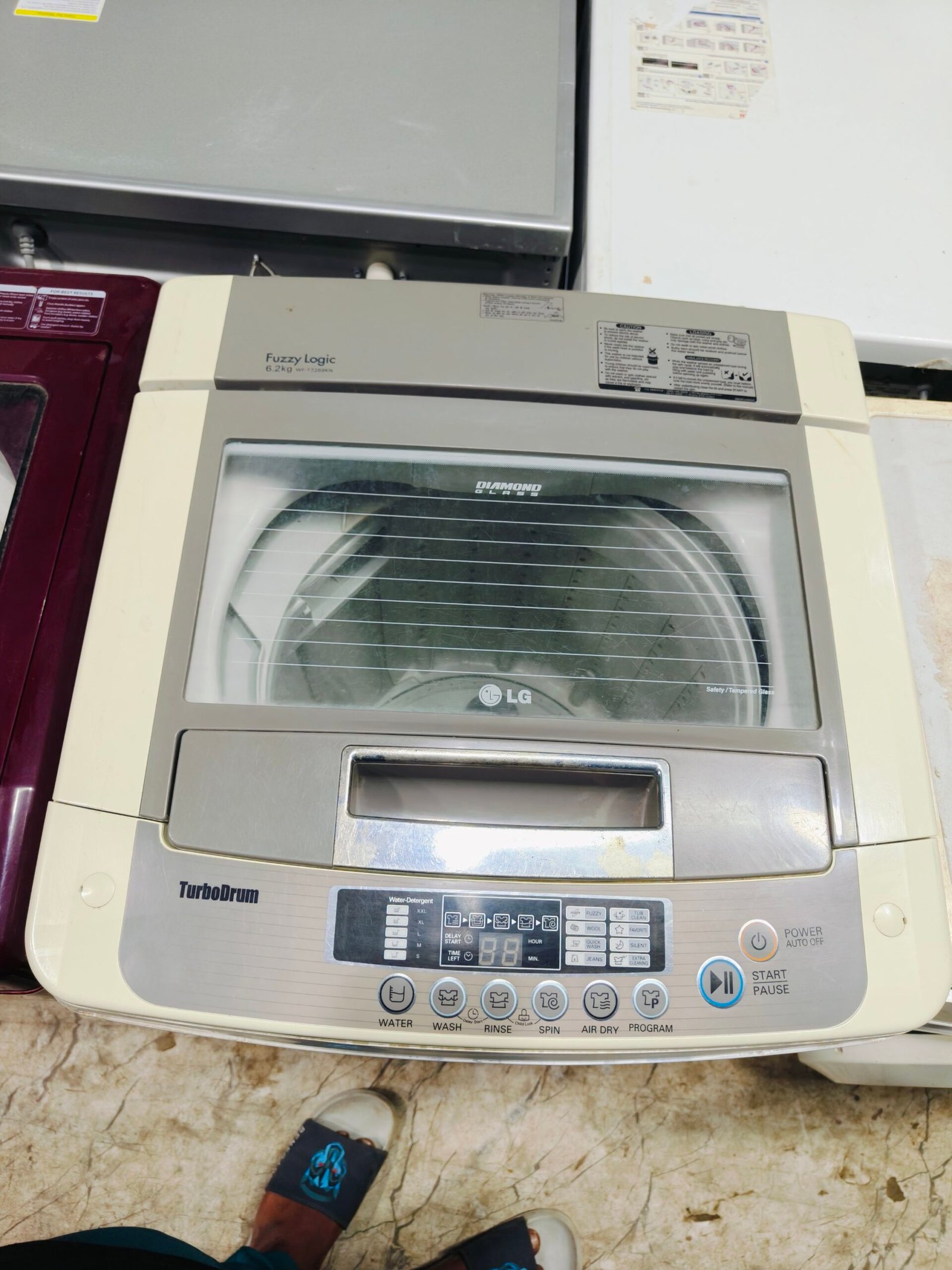 LG fuzzy logic turbo drum 6.2 kg fully automatic gently used top load washing machine - Image 4